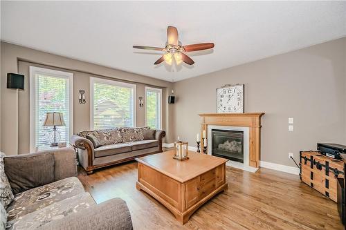Natural light floods into large family room - 61 Richmond Crescent, Stoney Creek, ON - Indoor Photo Showing Living Room With Fireplace