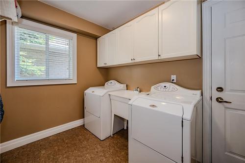 Main floor laundry leads to double garage with new insulated garage doors (2023). - 61 Richmond Crescent, Stoney Creek, ON - Indoor Photo Showing Laundry Room