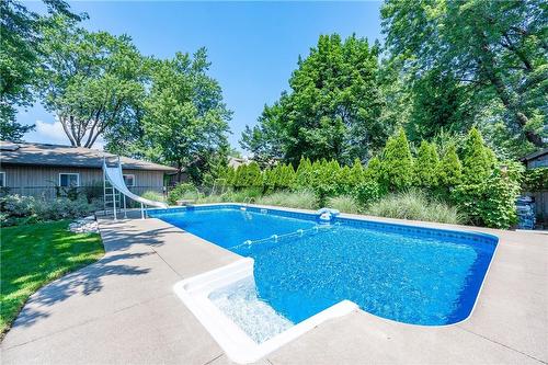 Step into the 16' by 38' heated salt water pool - 61 Richmond Crescent, Stoney Creek, ON - Outdoor With In Ground Pool With Backyard