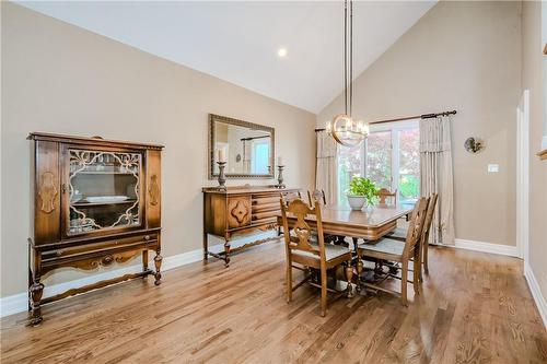 Formal dining room with vaulted ceilings overlooks the backyard oasis - 61 Richmond Crescent, Stoney Creek, ON - Indoor Photo Showing Dining Room