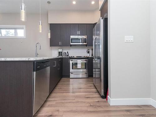 408-2655 Sooke Rd, Langford, BC - Indoor Photo Showing Kitchen With Stainless Steel Kitchen With Upgraded Kitchen