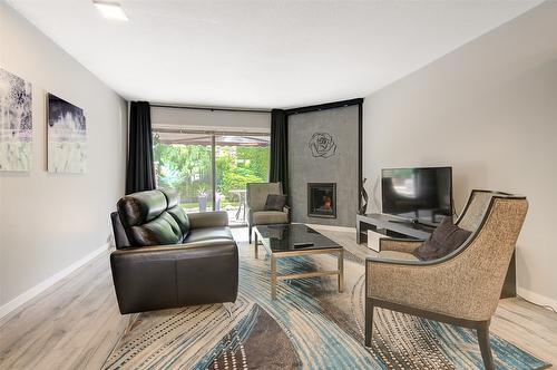 106-1765 Leckie Road, Kelowna, BC - Indoor Photo Showing Living Room With Fireplace