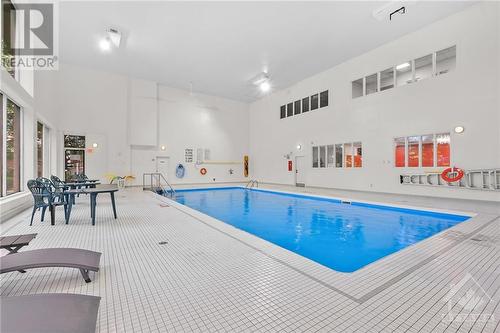 260 Brittany Drive Unit#103, Ottawa, ON - Indoor Photo Showing Other Room With In Ground Pool