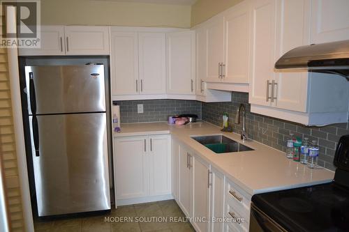 614 - 2550 Pharmacy Avenue, Toronto, ON - Indoor Photo Showing Kitchen With Double Sink