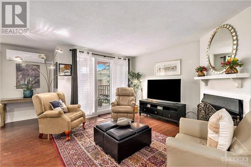 520 Canteval Terrace Unit#207, Ottawa, ON - Indoor Photo Showing Living Room With Fireplace