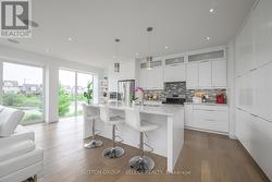 Sleek minimalist floor-to-ceiling cabinetry - - 