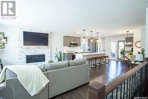 18 Chomyn Crescent, Saskatoon, SK - Indoor Photo Showing Living Room With Fireplace