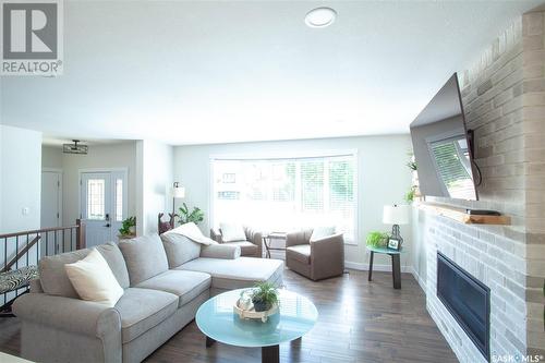 18 Chomyn Crescent, Saskatoon, SK - Indoor Photo Showing Living Room With Fireplace