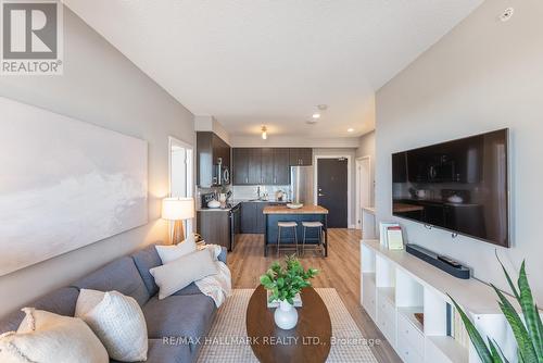 506 - 22 East Haven Drive, Toronto E06, ON - Indoor Photo Showing Living Room