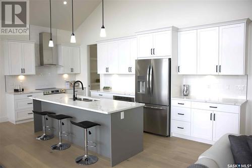 323 Woolf Bay, Saskatoon, SK - Indoor Photo Showing Kitchen With Stainless Steel Kitchen With Upgraded Kitchen