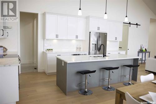 323 Woolf Bay, Saskatoon, SK - Indoor Photo Showing Kitchen With Upgraded Kitchen