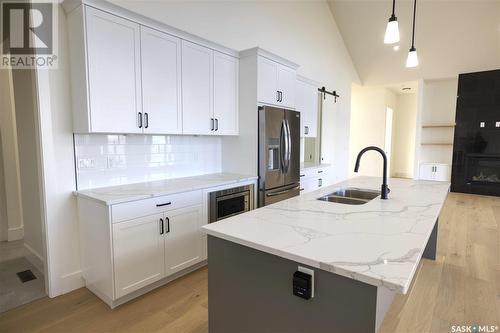 323 Woolf Bay, Saskatoon, SK - Indoor Photo Showing Kitchen With Double Sink With Upgraded Kitchen