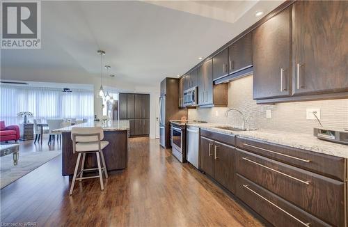 Check out the back splash - 265 Westcourt Place Unit# 206, Waterloo, ON - Indoor Photo Showing Kitchen With Upgraded Kitchen