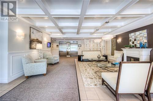 view to elevators in Lobby - 265 Westcourt Place Unit# 206, Waterloo, ON - Indoor Photo Showing Other Room With Fireplace