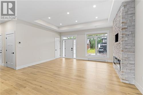 60 Guy, Shediac, NB - Indoor Photo Showing Other Room With Fireplace