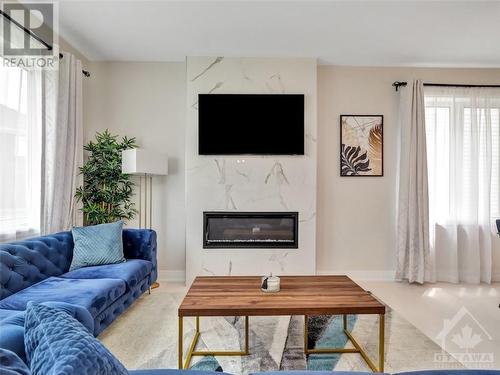 2007 Elevation Road, Ottawa, ON - Indoor Photo Showing Living Room With Fireplace