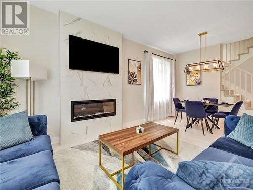 2007 Elevation Road, Ottawa, ON - Indoor Photo Showing Living Room With Fireplace