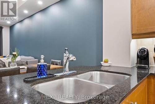 101 - 12 Rean Drive, Toronto, ON - Indoor Photo Showing Kitchen With Double Sink