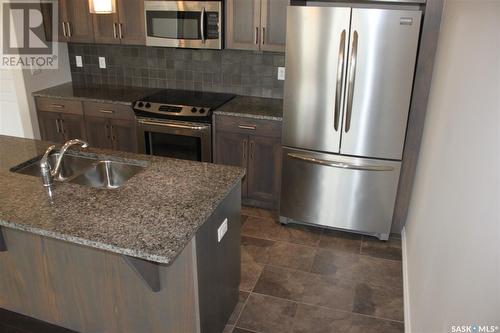 307 1715 Badham Boulevard, Regina, SK - Indoor Photo Showing Kitchen With Double Sink With Upgraded Kitchen