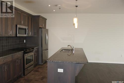 307 1715 Badham Boulevard, Regina, SK - Indoor Photo Showing Kitchen With Upgraded Kitchen