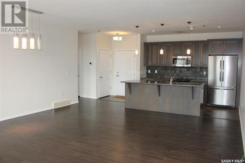 307 1715 Badham Boulevard, Regina, SK - Indoor Photo Showing Kitchen With Double Sink