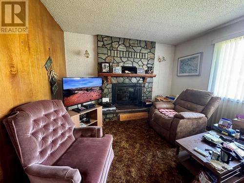 921 91A Avenue, Dawson Creek, BC - Indoor Photo Showing Living Room With Fireplace