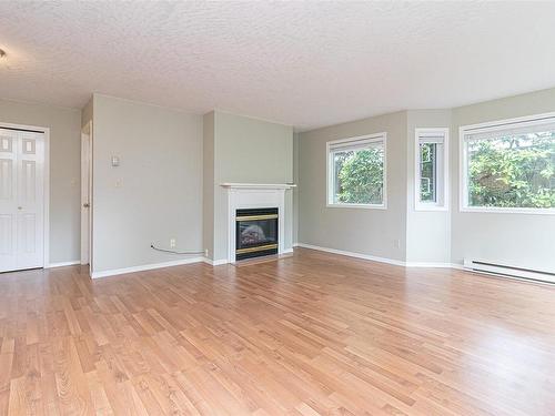 106-9882 Fifth St, Sidney, BC - Indoor Photo Showing Living Room With Fireplace