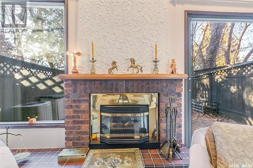 27 Quincy Drive, Regina, SK - Indoor Photo Showing Living Room With Fireplace