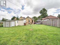 Fully fenced lot with garage & garden shed - 