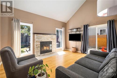 11 Wildbriar Way, Ottawa, ON - Indoor Photo Showing Living Room With Fireplace