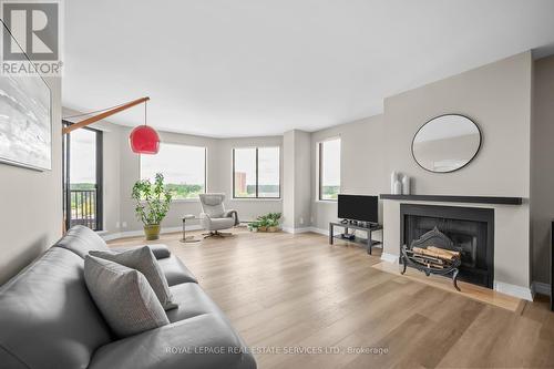 1104 - 100 Lakeshore Road E, Oakville (Old Oakville), ON - Indoor Photo Showing Living Room With Fireplace