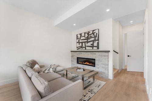 3462 Hilltown Close, Kelowna, BC - Indoor Photo Showing Living Room With Fireplace