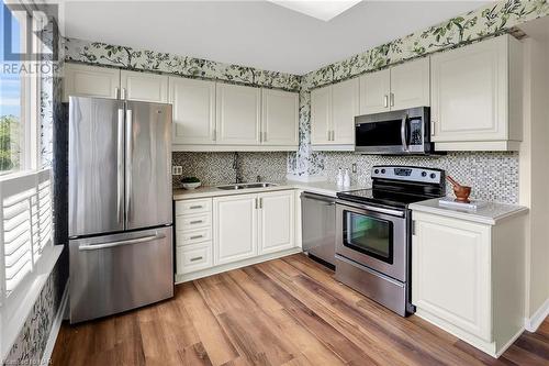 Lots of cabinet space including the breakfast bar. - 3 Towering Hts Boulevard Unit# 303, St. Catharines, ON 