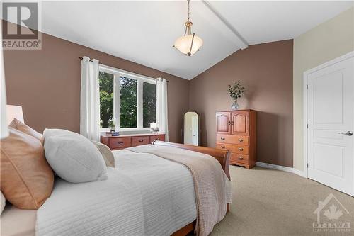 Alternate view of the primary bedroom overlooking the private treed backyard. Walk-in closet is to the right of the entry door. - 470 Landswood Way, Ottawa, ON - Indoor Photo Showing Bedroom