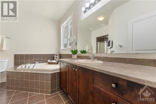 Ensuite bathroom with separate jet tub for a spa-like feel at home. - 470 Landswood Way, Ottawa, ON - Indoor Photo Showing Bathroom