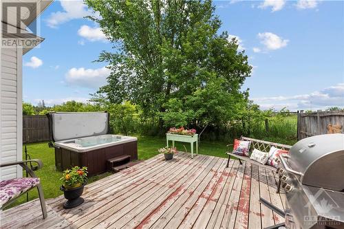 Peaceful and private backyard with no rear neighbours overlooking farm land! Perfect place to connect with nature as you drink your morning coffee or entertain friends and family. - 470 Landswood Way, Ottawa, ON - Outdoor With Deck Patio Veranda