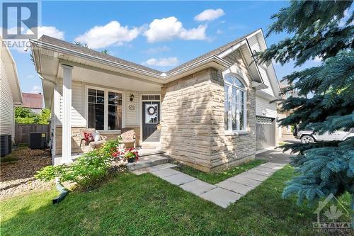 Cozy front porch tucked away. Perfect for people-watching and waving at neighbours taking a stroll through the beautiful neighbourhood. - 470 Landswood Way, Ottawa, ON - Outdoor