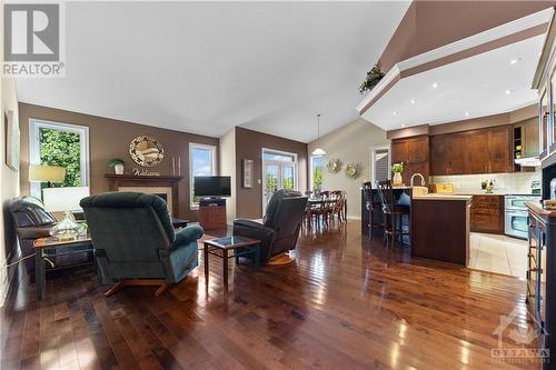 Beautiful gleaming hardwood floors and impressively high vaulted ceiling in this grand living area made for entertaining. - 470 Landswood Way, Ottawa, ON - Indoor