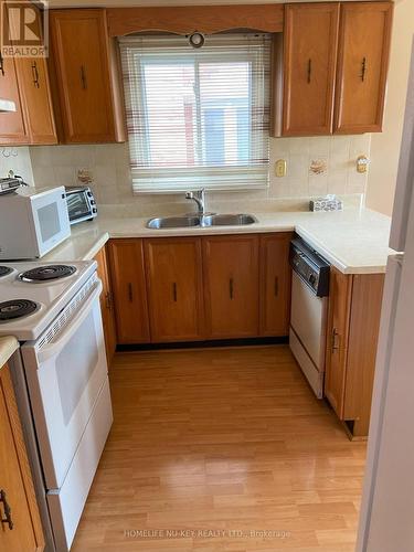 180 Kingsbridge Garden Circle, Mississauga, ON - Indoor Photo Showing Kitchen With Double Sink