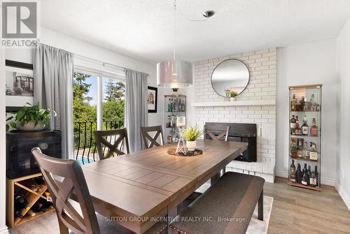 912 Sloan Circle Drive, Innisfil, ON - Indoor Photo Showing Dining Room With Fireplace