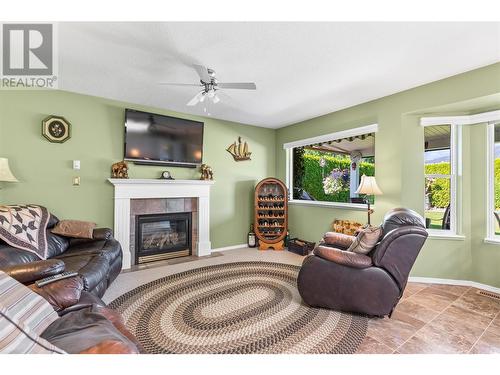 504 5 Street Lot# 27-72, Vernon, BC - Indoor Photo Showing Living Room With Fireplace