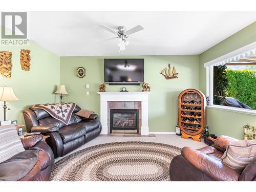 504 5 Street Lot# 27-72, Vernon, BC - Indoor Photo Showing Living Room With Fireplace