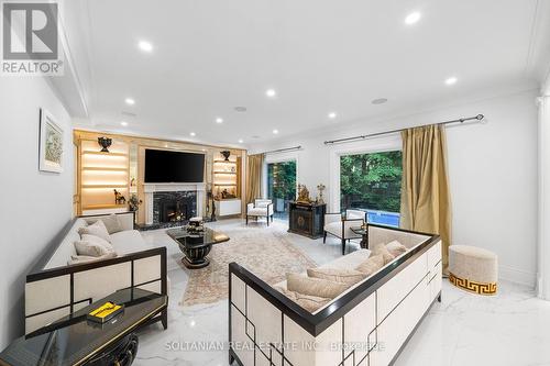 15 Berkindale Drive, Toronto, ON - Indoor Photo Showing Living Room With Fireplace