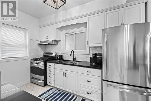 5317 Third Avenue, Niagara Falls, ON - Indoor Photo Showing Kitchen With Double Sink