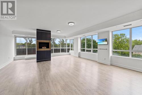 514 - 7608 Yonge Street, Vaughan, ON - Indoor Photo Showing Living Room With Fireplace