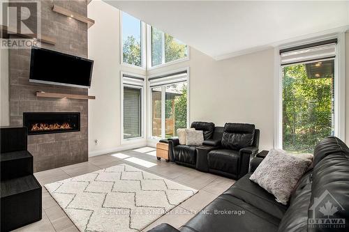 124 Hybrid Street, Russell, ON - Indoor Photo Showing Living Room With Fireplace