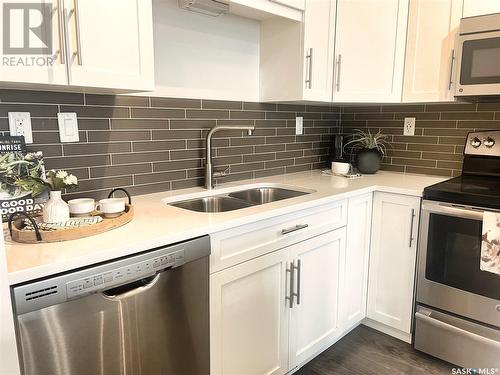 218 545 Hassard Close, Saskatoon, SK - Indoor Photo Showing Kitchen With Stainless Steel Kitchen With Double Sink With Upgraded Kitchen