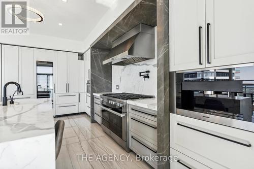 Ph 4104 - 33 Shore Breeze Drive, Toronto, ON - Indoor Photo Showing Kitchen With Upgraded Kitchen