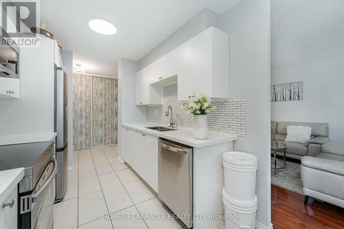 305 - 5580 Sheppard Avenue E, Toronto E11, ON - Indoor Photo Showing Kitchen With Double Sink