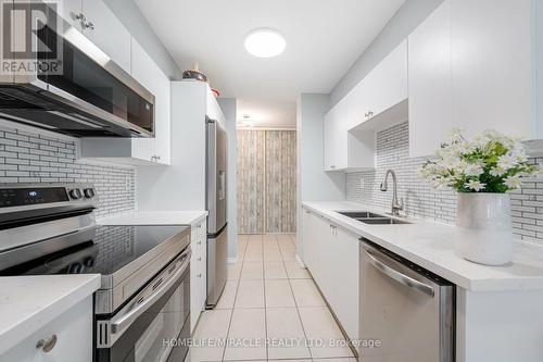 305 - 5580 Sheppard Avenue E, Toronto E11, ON - Indoor Photo Showing Kitchen With Double Sink With Upgraded Kitchen